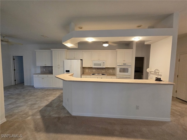 kitchen featuring white cabinetry, backsplash, ceiling fan, and white appliances