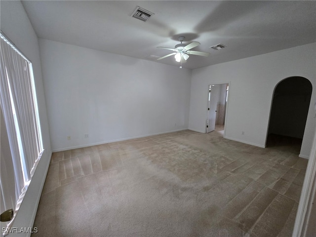 carpeted empty room with ceiling fan