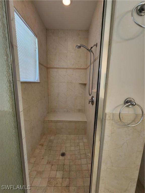 bathroom with an enclosed shower