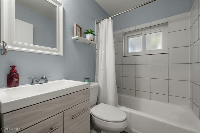 full bathroom with shower / bathtub combination with curtain, vanity, and toilet