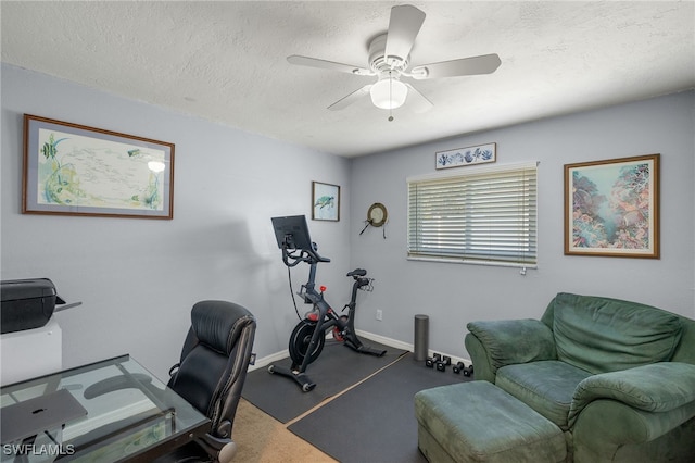 office space featuring ceiling fan and a textured ceiling