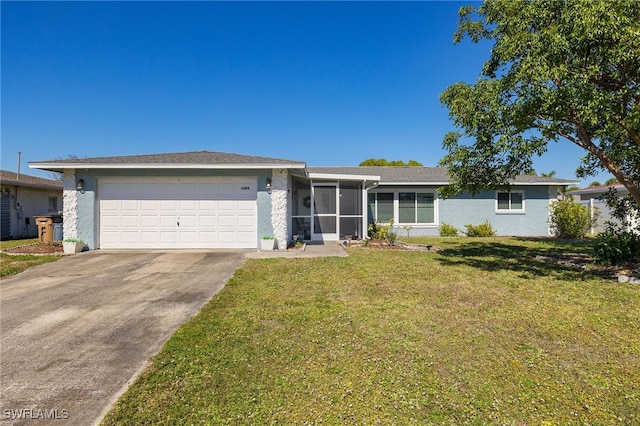 ranch-style house featuring a garage and a front lawn