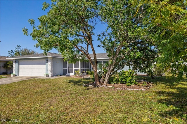 single story home featuring a garage and a front yard