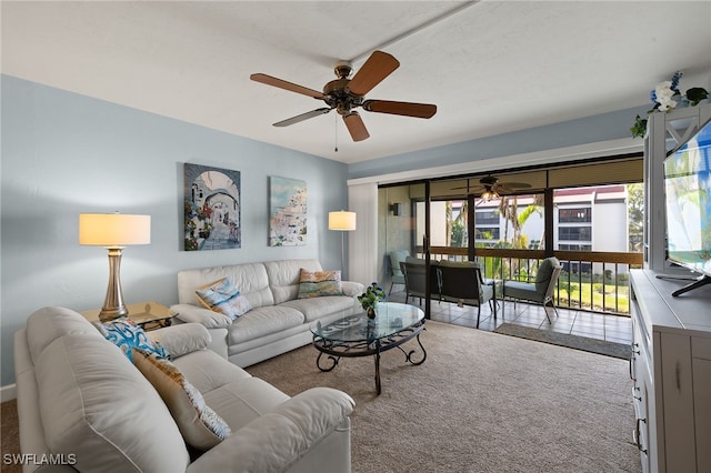 living room with ceiling fan and carpet flooring