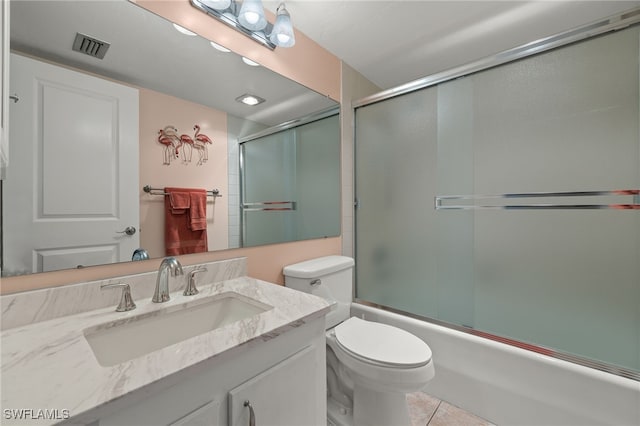 full bathroom with vanity, tile patterned flooring, enclosed tub / shower combo, and toilet