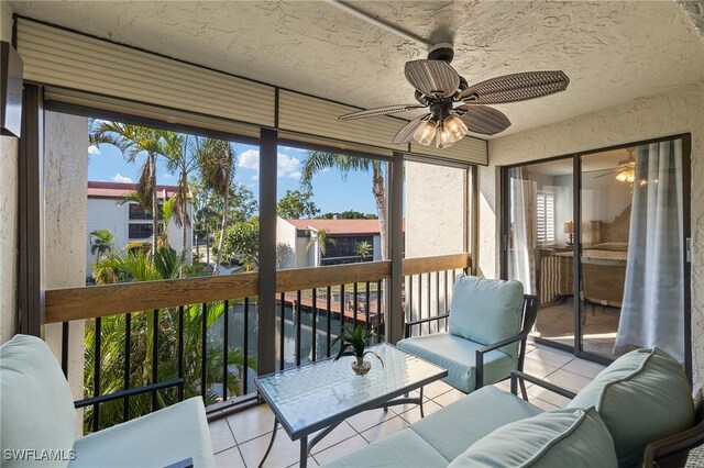 sunroom featuring ceiling fan and a healthy amount of sunlight