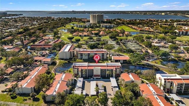 birds eye view of property with a water view