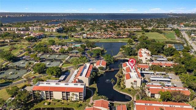 birds eye view of property with a water view