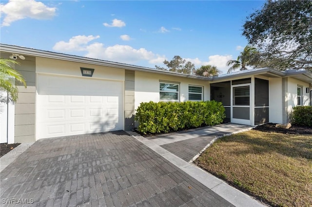 view of front of home featuring a garage and a front yard