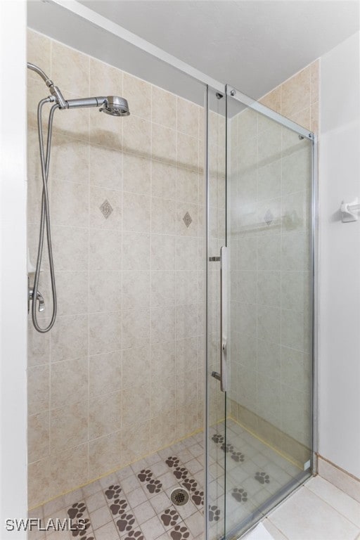 bathroom with a shower with shower door