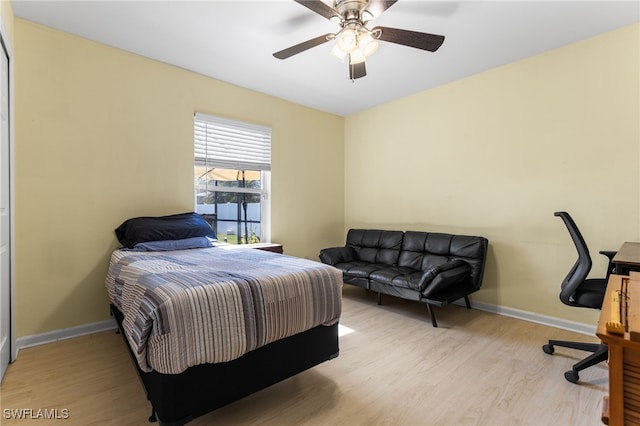 bedroom featuring light hardwood / wood-style flooring and ceiling fan