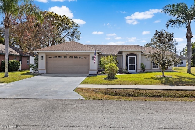 single story home featuring a garage and a front lawn