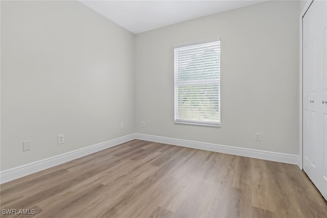 spare room featuring light hardwood / wood-style flooring