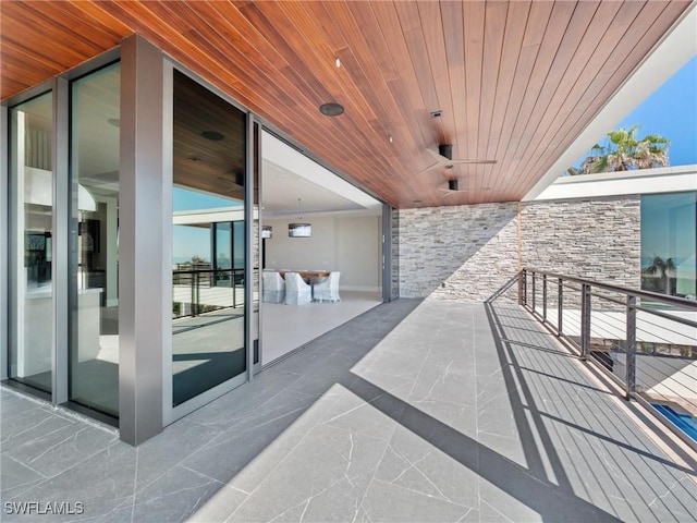 exterior space featuring ceiling fan and a patio area