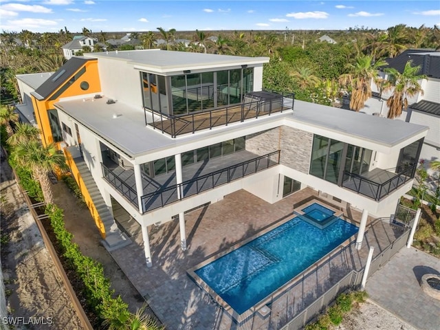 back of house with a patio