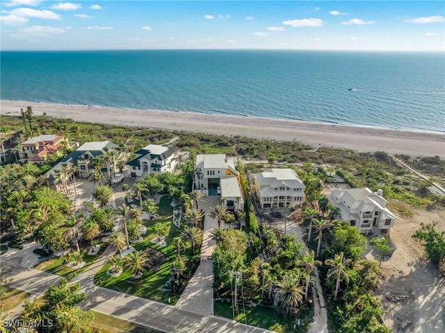 bird's eye view with a water view and a beach view