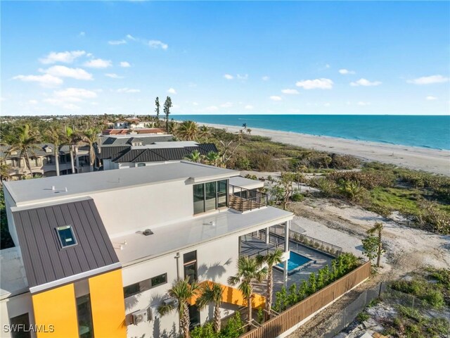 aerial view featuring a water view and a beach view