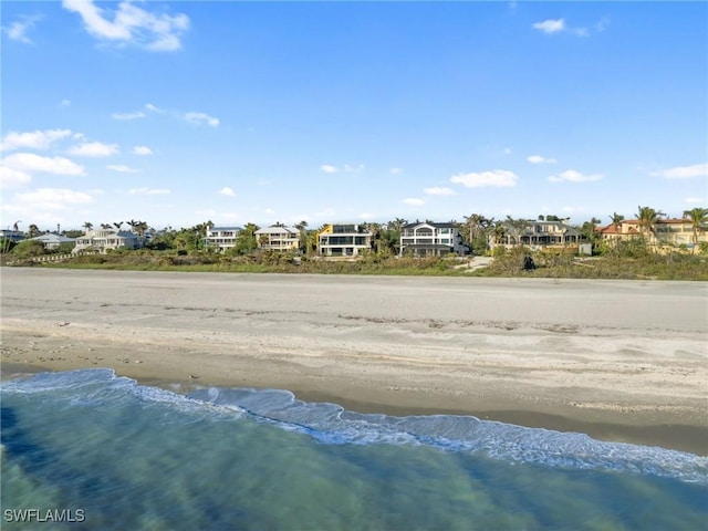 view of road with a beach view and a water view