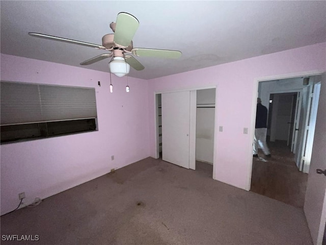 unfurnished bedroom with carpet, ceiling fan, and a closet