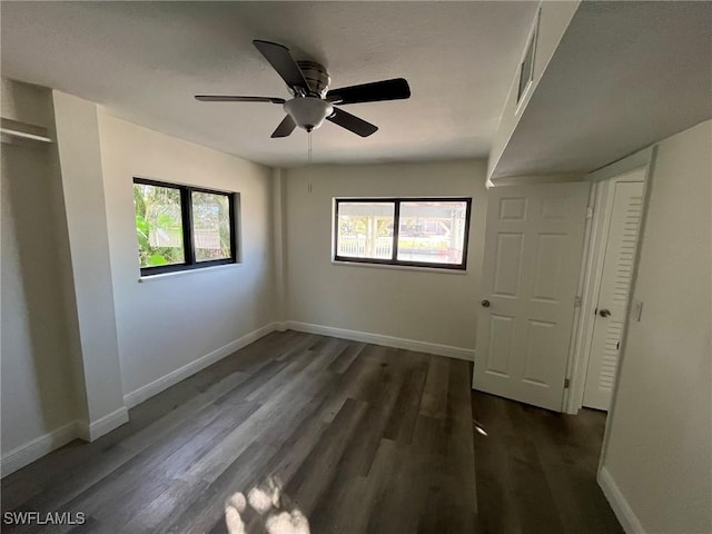 21551 Madera Rd, Fort Myers Beach, FL 33931 - unfurnished bedroom with dark wood-type flooring and a ceiling fan