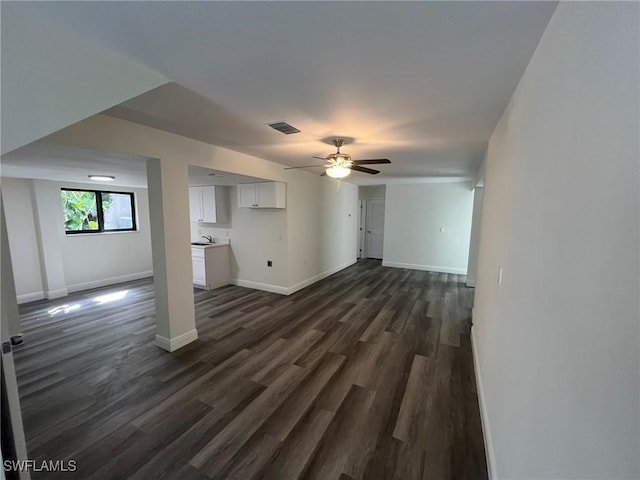 21551 Madera Rd, Fort Myers Beach, FL 33931 - unfurnished living room with a ceiling fan and dark wood finished floors
