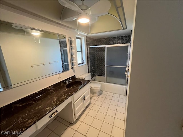 21551 Madera Rd, Fort Myers Beach, FL 33931 - full bathroom with tile patterned floors, vanity, shower / bath combination with glass door, and a ceiling fan