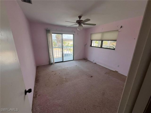 21551 Madera Rd, Fort Myers Beach, FL 33931 - carpeted empty room with ceiling fan
