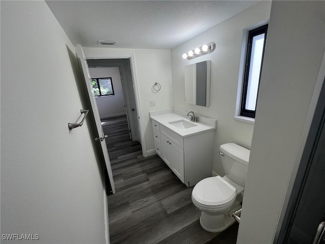 21551 Madera Rd, Fort Myers Beach, FL 33931 - bathroom featuring vanity, wood finished floors, and a textured ceiling