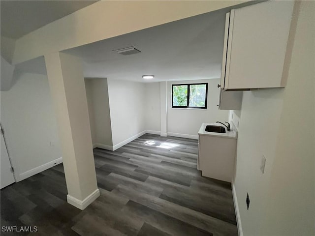 21551 Madera Rd, Fort Myers Beach, FL 33931 - below grade area featuring a sink and dark wood-type flooring