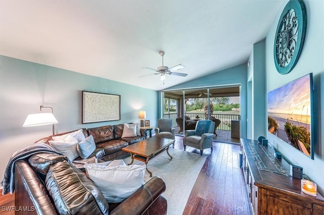 living room with lofted ceiling, dark wood-type flooring, and ceiling fan