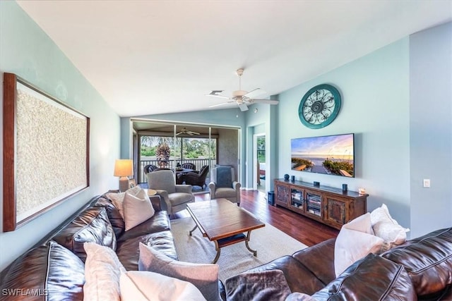 living room with lofted ceiling, dark hardwood / wood-style floors, and ceiling fan