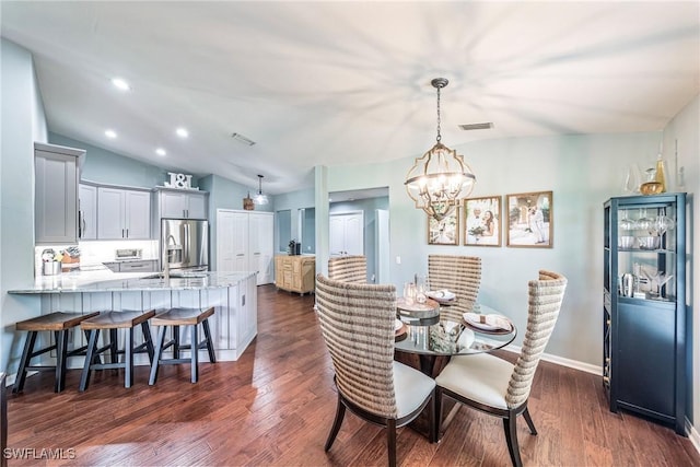 23566 Sandycreek Ter Unit 1409, Estero, FL 34135 - dining room featuring a chandelier, dark wood-type flooring, lofted ceiling, and recessed lighting