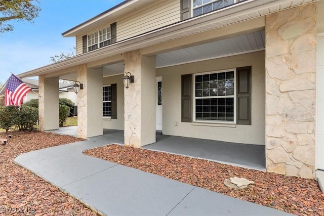 doorway to property featuring a porch