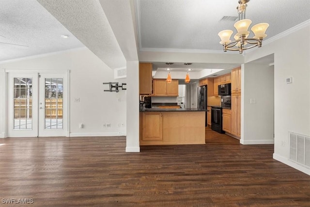 kitchen with dark hardwood / wood-style flooring, decorative light fixtures, kitchen peninsula, and range