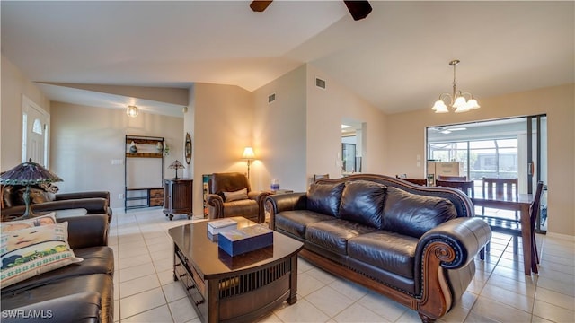 living room featuring vaulted ceiling, ceiling fan with notable chandelier, and light tile patterned floors