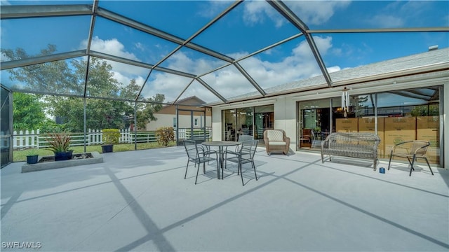 view of patio / terrace featuring glass enclosure