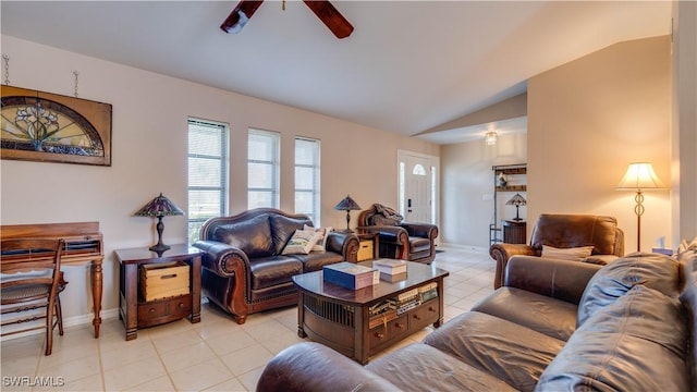 living room with ceiling fan, lofted ceiling, and light tile patterned floors