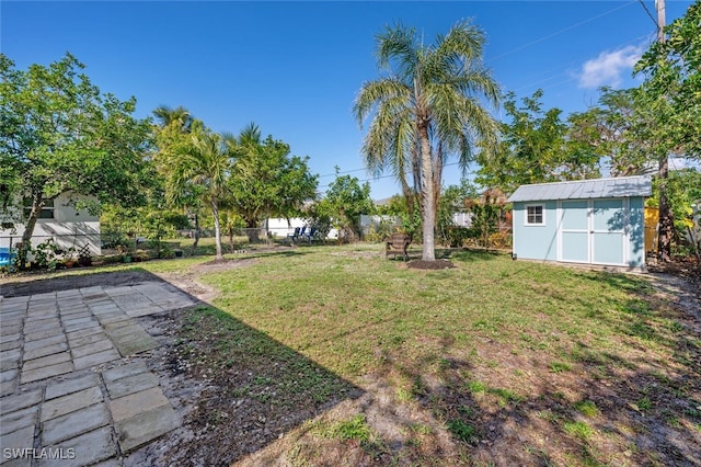 view of yard with a storage unit