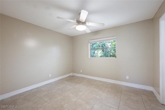 tiled empty room with ceiling fan