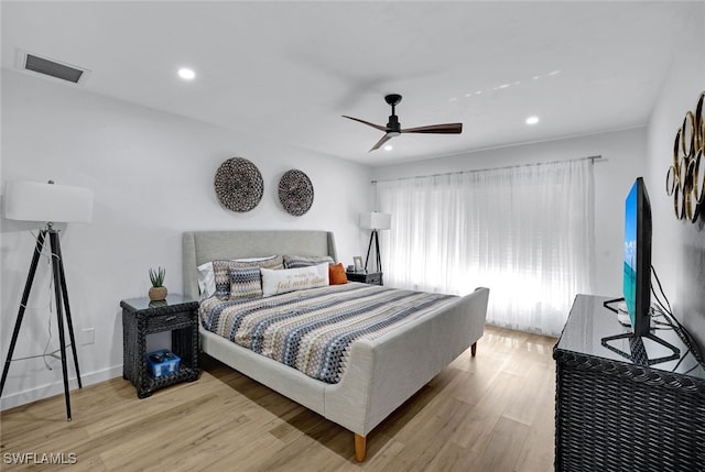 bedroom featuring light hardwood / wood-style flooring and ceiling fan