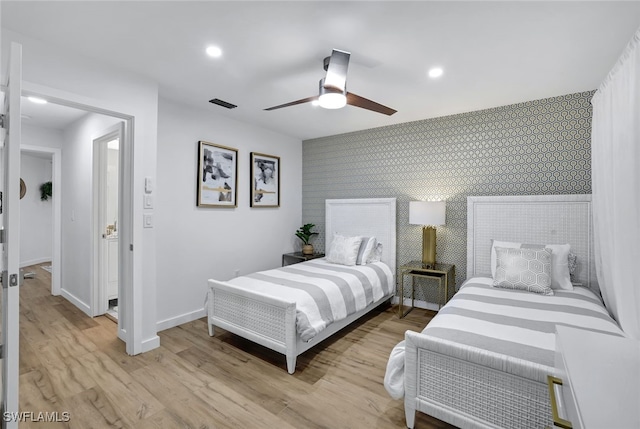 bedroom featuring ceiling fan and light wood-type flooring