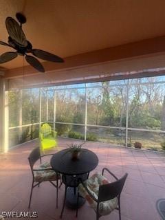 sunroom featuring ceiling fan