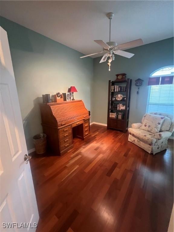 home office featuring baseboards, wood finished floors, and a ceiling fan