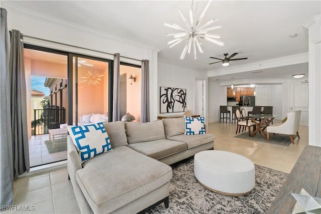 living room featuring light tile patterned flooring, ornamental molding, and ceiling fan with notable chandelier