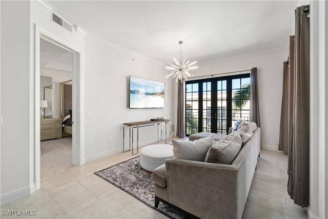 tiled living room with ornamental molding, a notable chandelier, and french doors