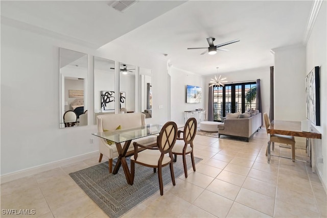 tiled dining area with crown molding and ceiling fan with notable chandelier