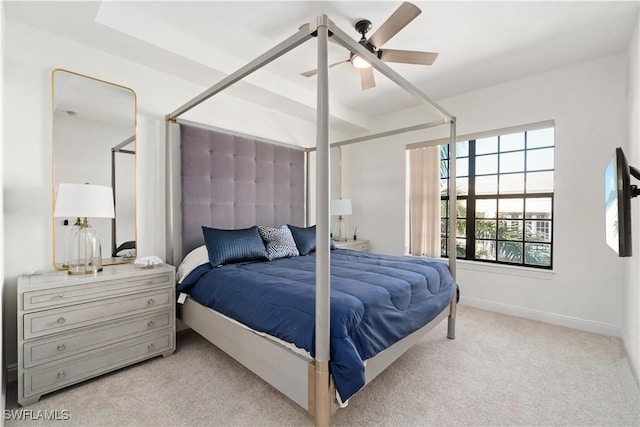 bedroom featuring light carpet and ceiling fan