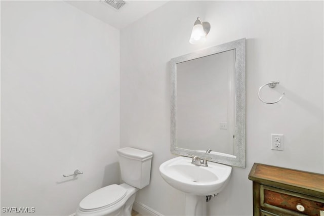 bathroom with toilet and sink