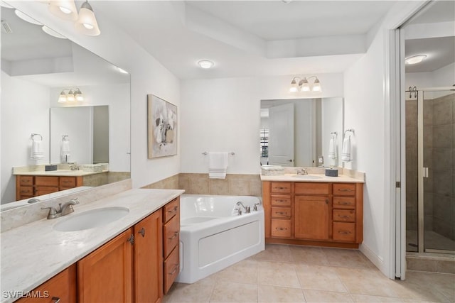 bathroom featuring plus walk in shower, tile patterned floors, and vanity