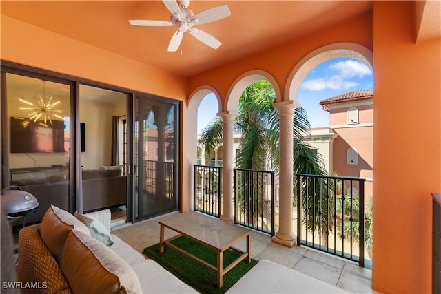 exterior space featuring a balcony and ceiling fan